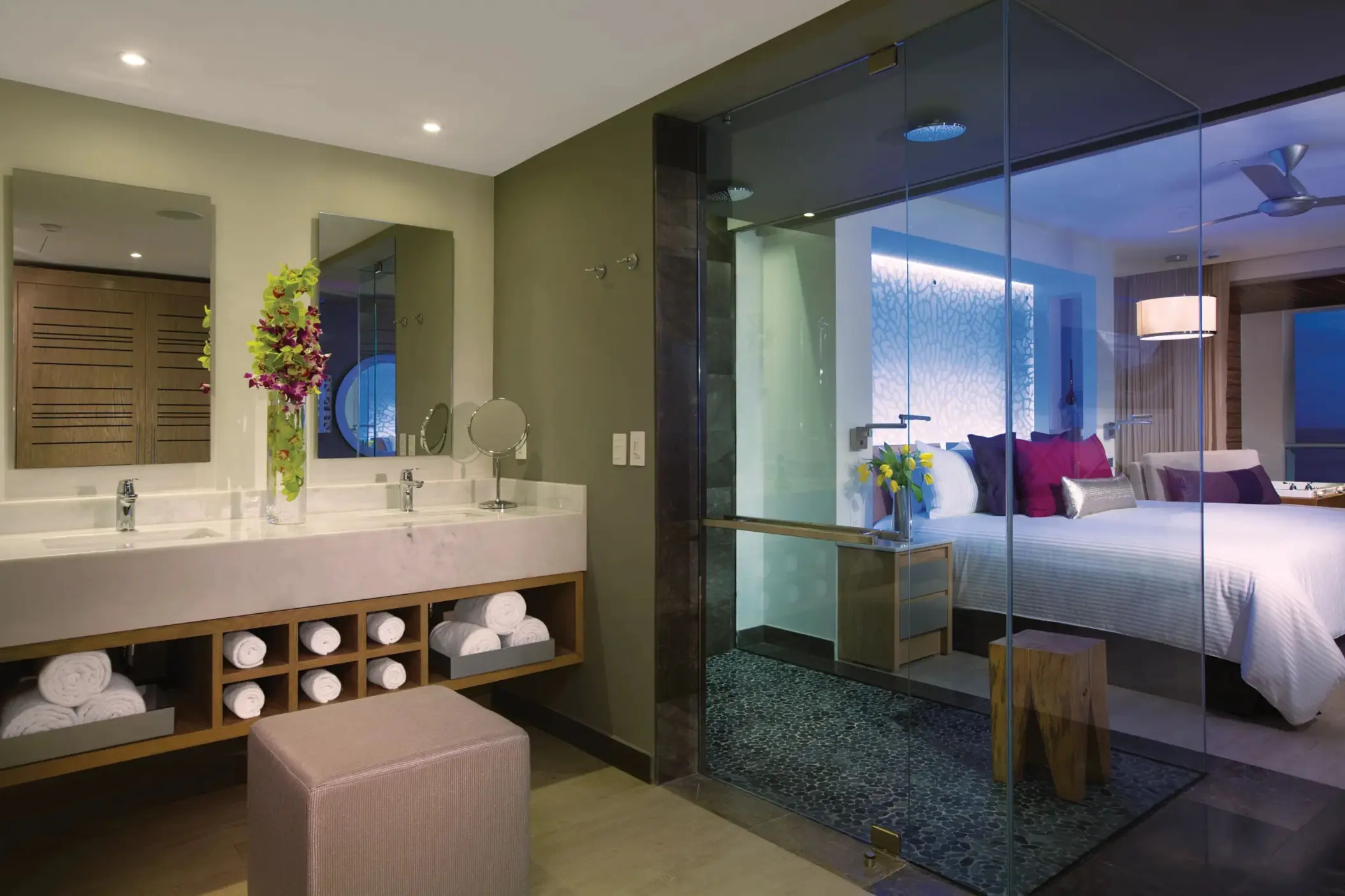 Modern bathroom with dual vanities, rainfall shower, and spa-style design.