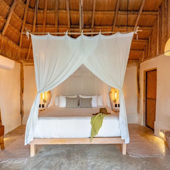 suite with poster bed at Casa Ganesh tulum