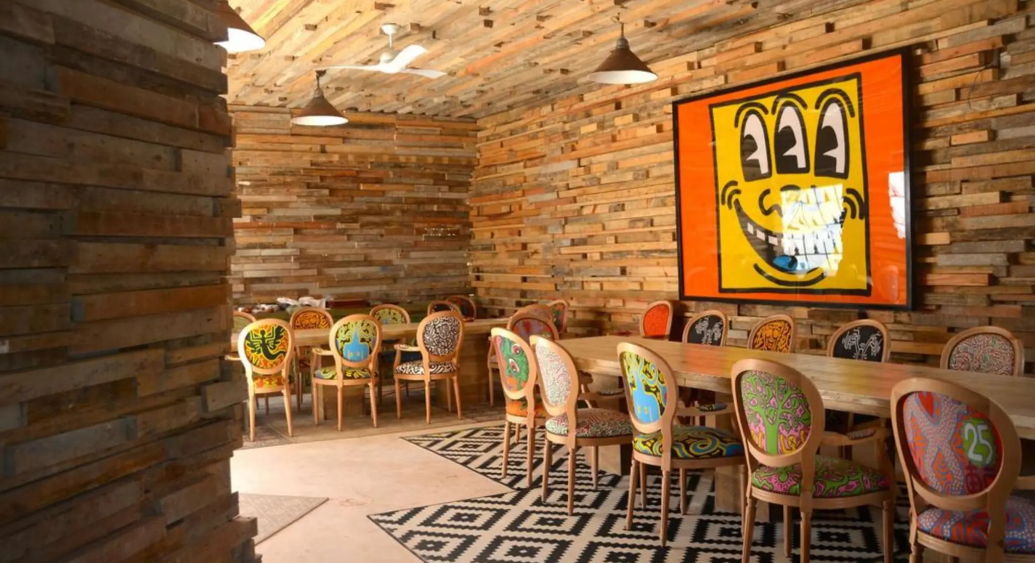 restaurant with funky wall art at Casa Malca