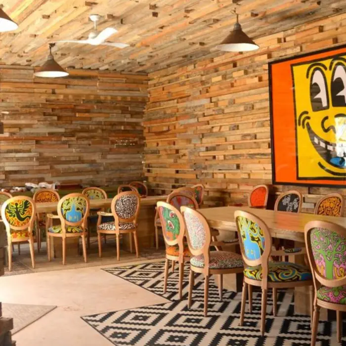 restaurant with funky wall art at Casa Malca