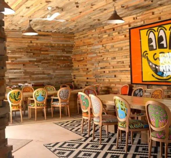 restaurant with funky wall art at Casa Malca