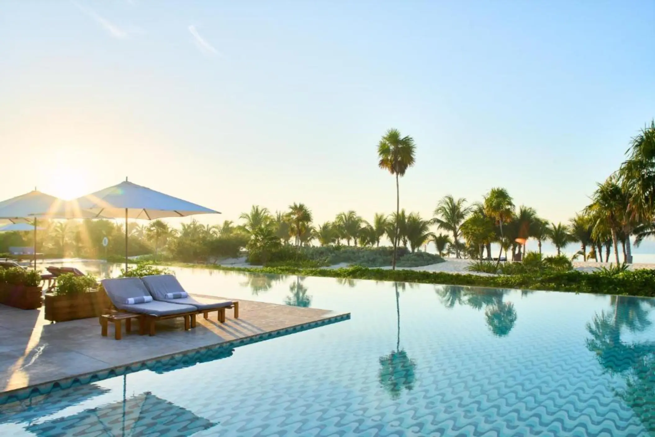 pool with loungers at Chable Maroma