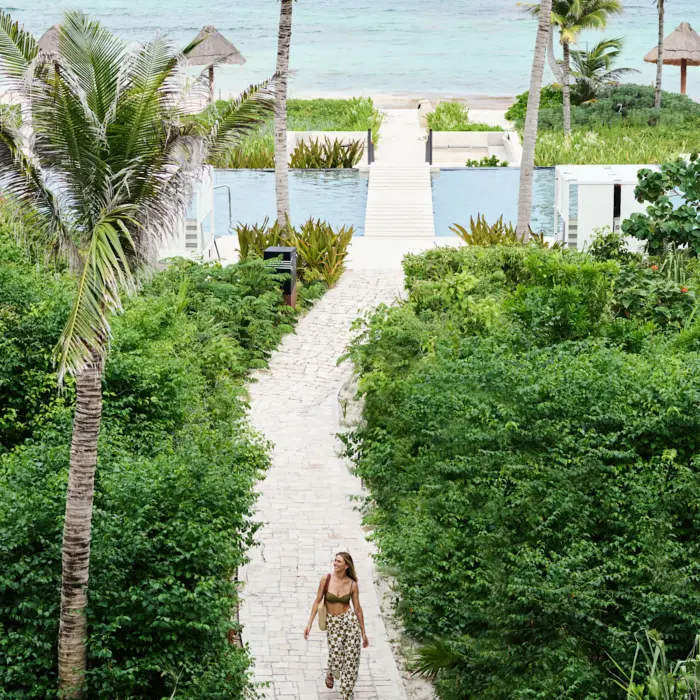 walkway leading to the beach at Conrad Tulum