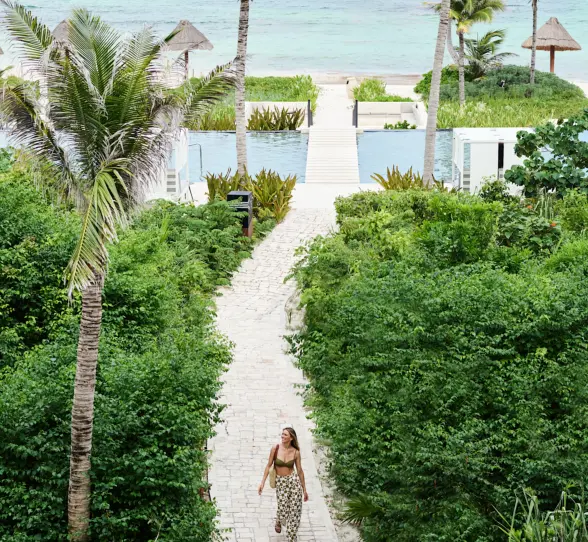 walkway leading to the beach at Conrad Tulum