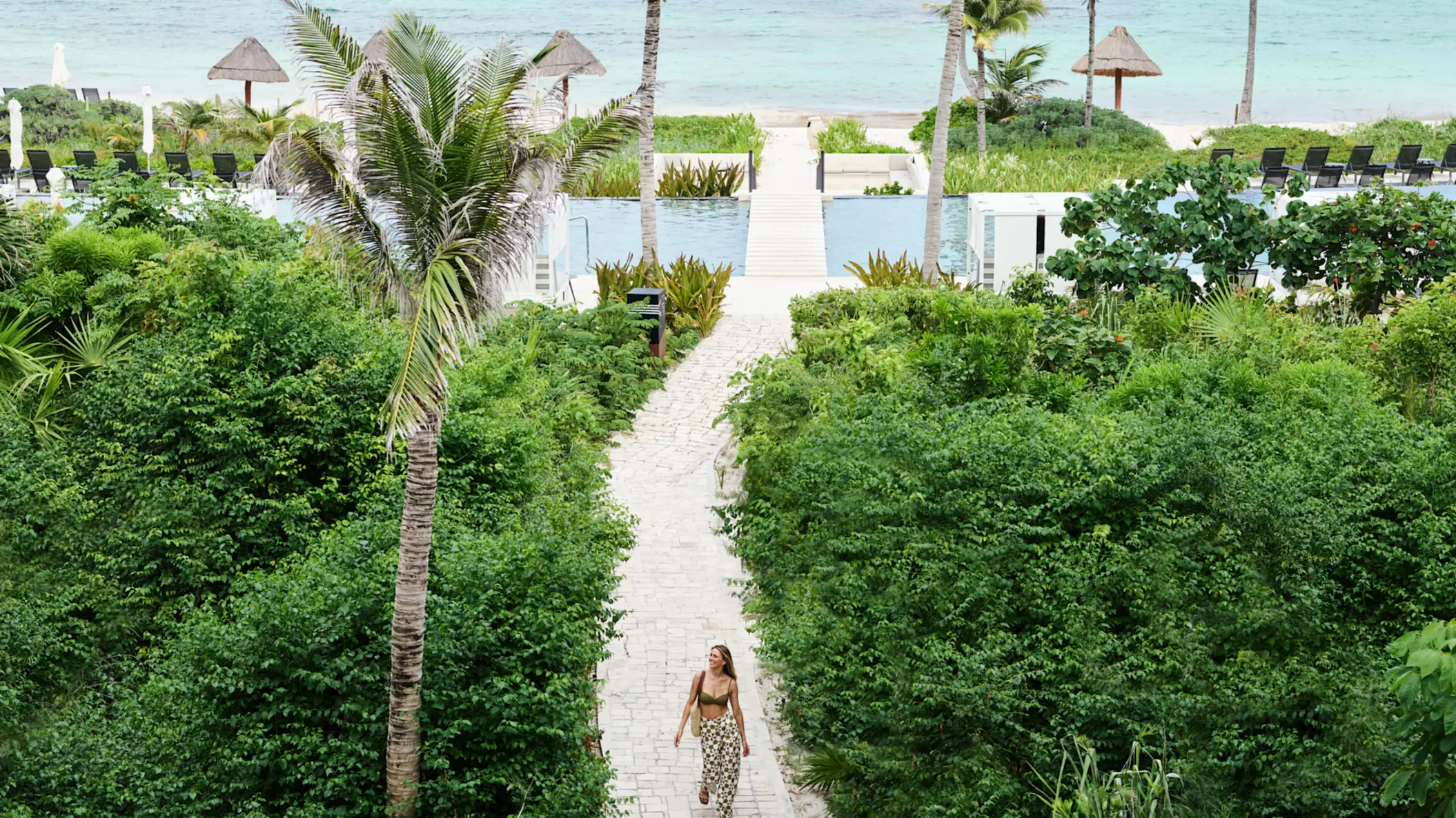walkway leading to the beach at Conrad Tulum