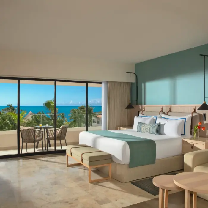 Ocean view deluxe room with chic furnishings and panoramic vistas of turquoise waters.