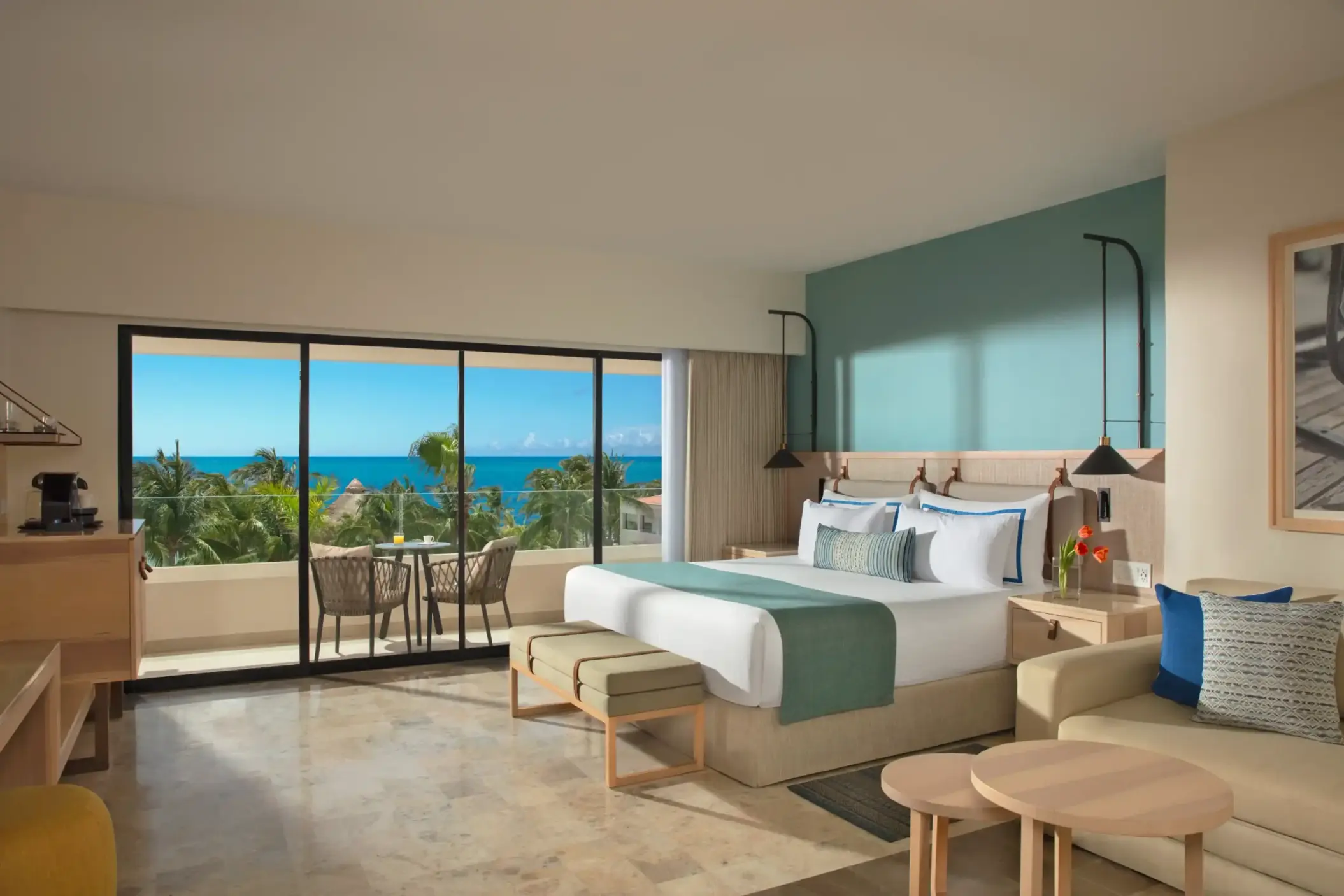 Ocean view deluxe room with chic furnishings and panoramic vistas of turquoise waters.