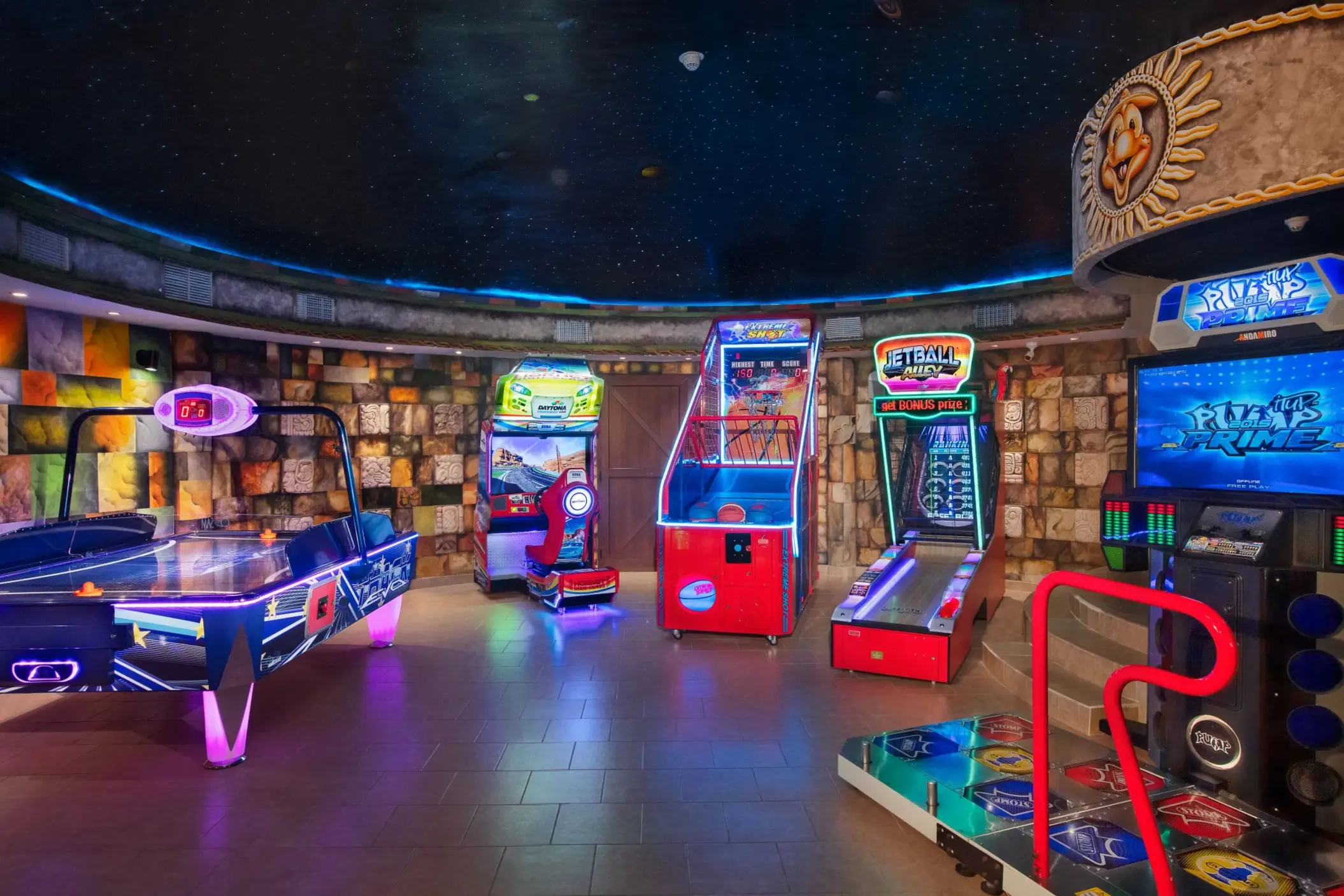 Fully equipped indoor arcade with video games and air hockey table at Dreams Riviera Cancun Explorer’s Club