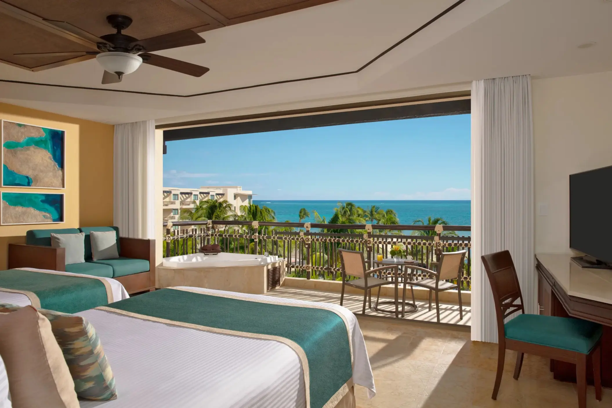 Oceanfront double room with outdoor Jacuzzi and panoramic Caribbean views.