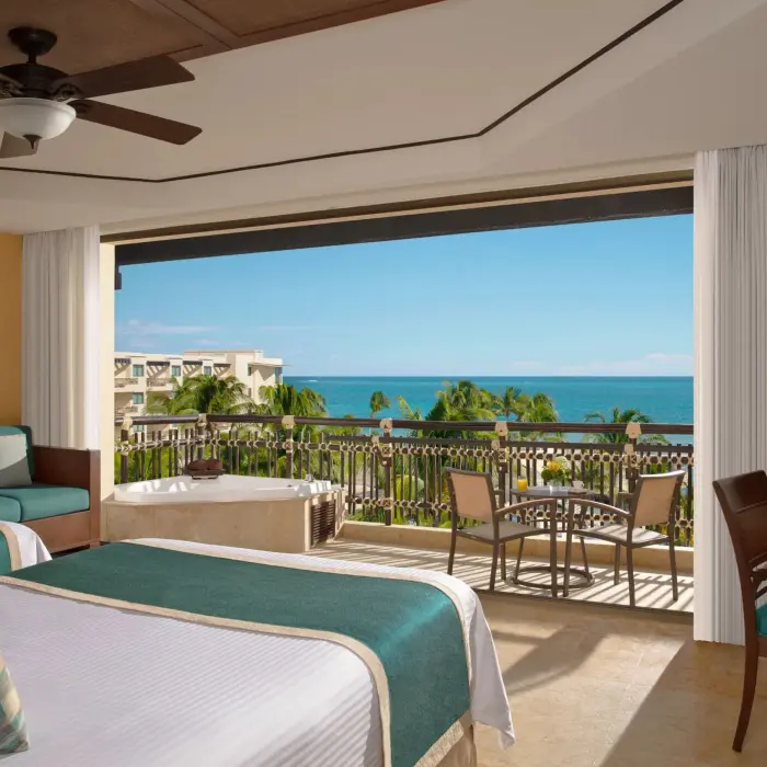 Oceanfront double room with outdoor Jacuzzi and panoramic Caribbean views.