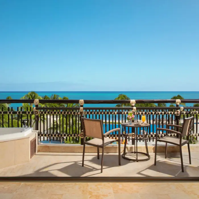 Terrace view with Jacuzzi tub and ocean backdrop from the Ocean Pool Front Suite.