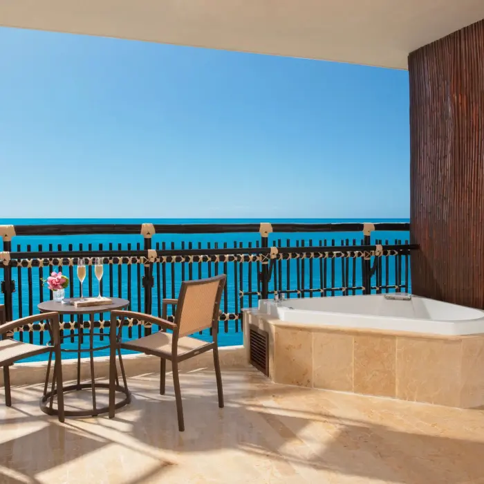 Private terrace with oceanview Jacuzzi and two-chair breakfast table in Honeymoon Suite.