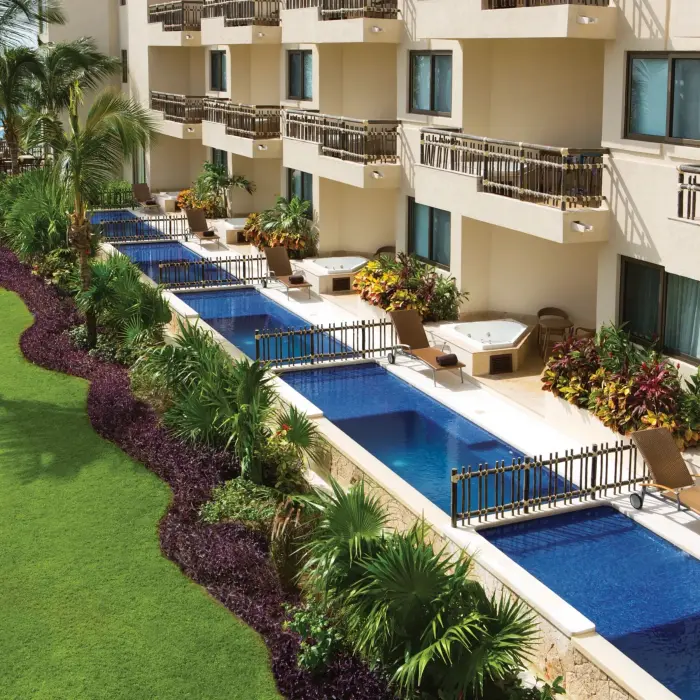 Ground-level swim-out suites with plunge pools and lush garden views.