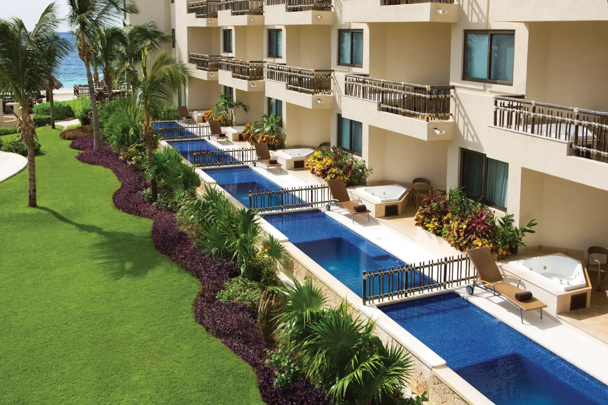 Ground-level swim-out suites with plunge pools and lush garden views.