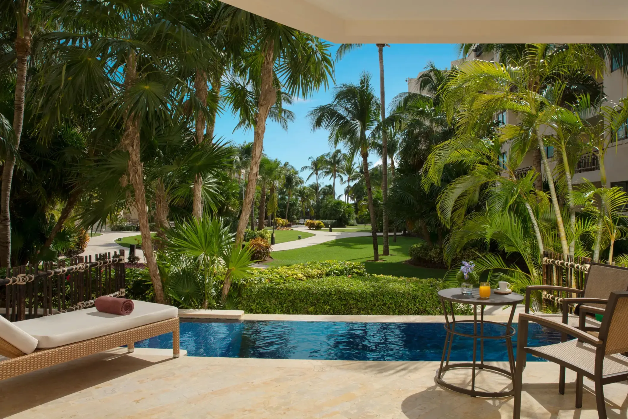 Private terrace with lush garden views and small plunge pool.