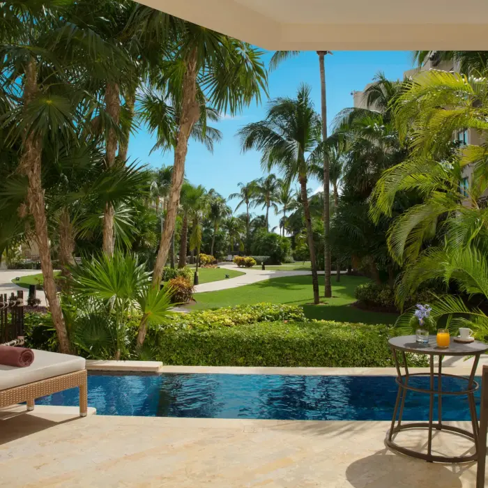 Private terrace with lush garden views and small plunge pool.