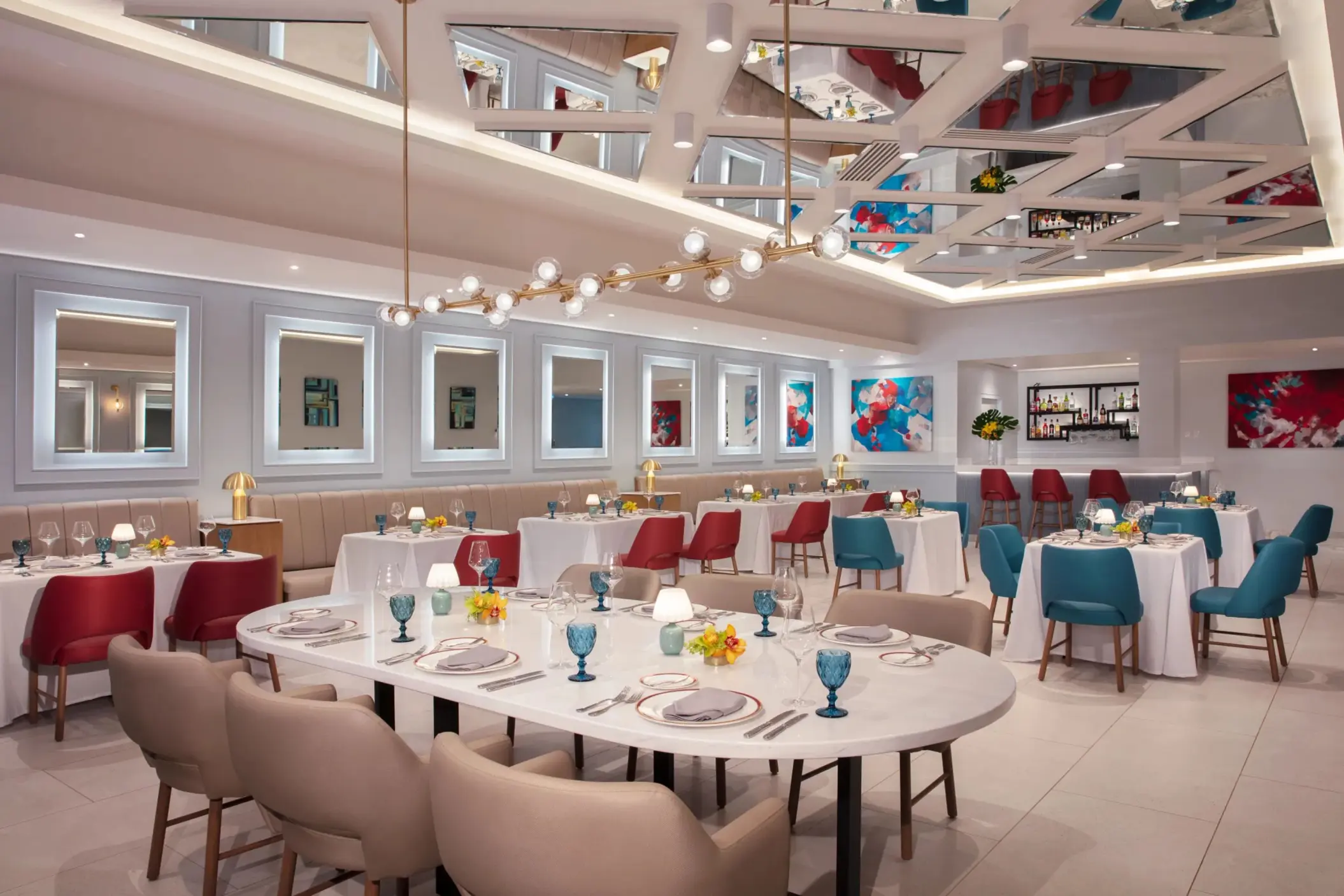 Modern Italian dining room at Portofino in Dreams Riviera Cancun featuring colorful accents and chic design.