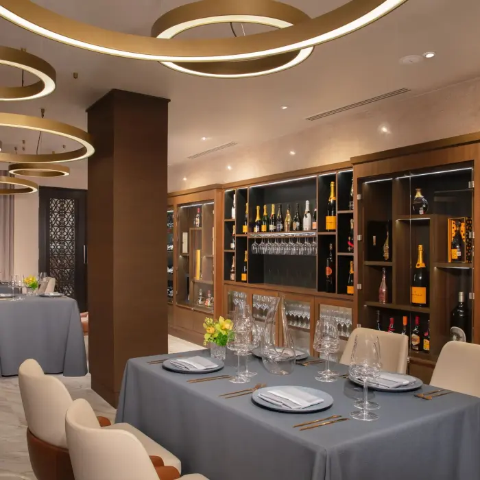 Elegant wine cellar dining area at Dreams Riviera Cancun with stylish lighting and premium wine displays.