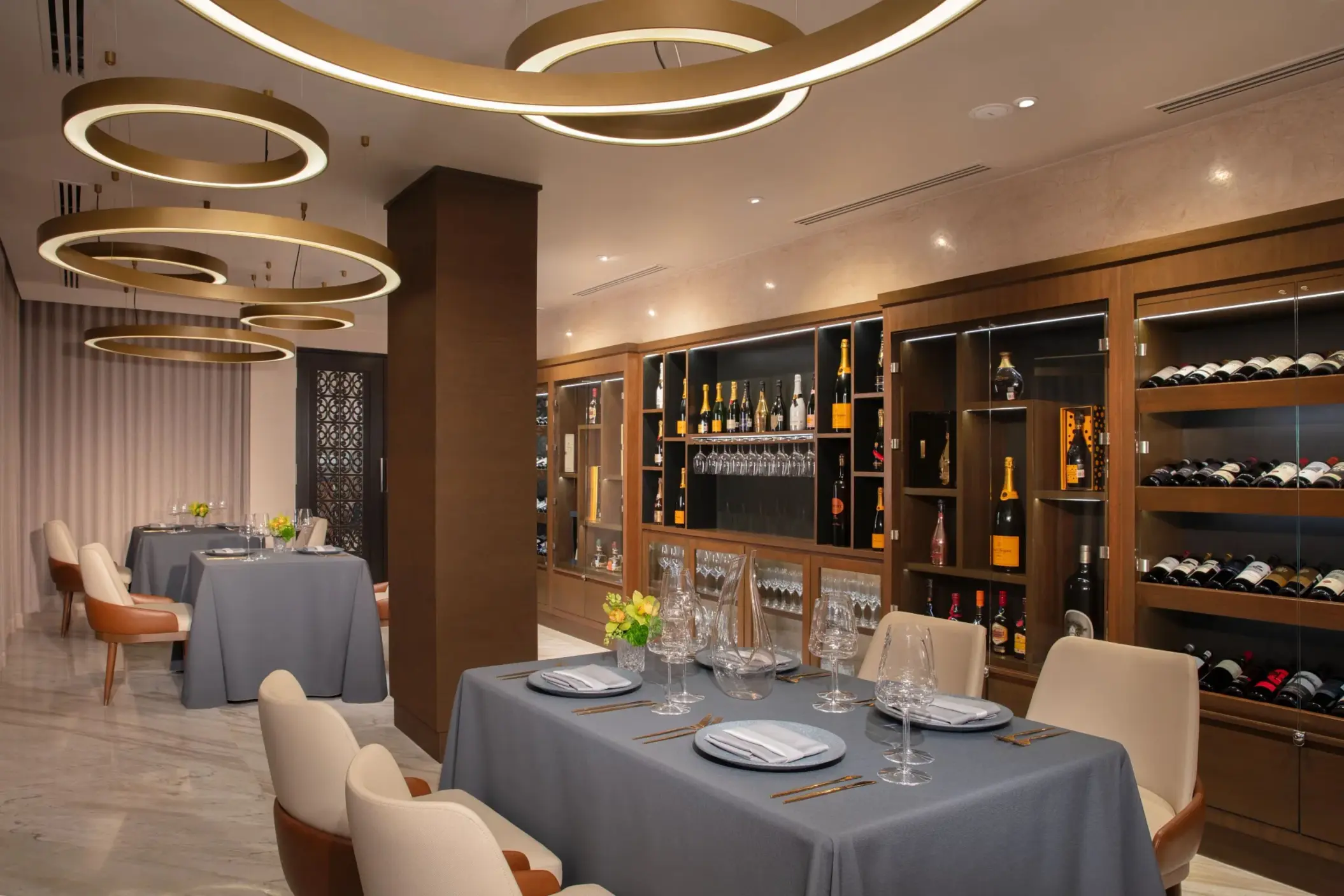 Elegant wine cellar dining area at Dreams Riviera Cancun with stylish lighting and premium wine displays.