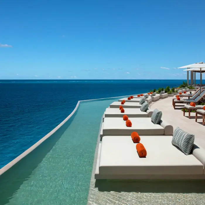 Chic rooftop lounge with panoramic views at Dreams Sapphire Resort & Spa, perfect for cocktails and stargazing.