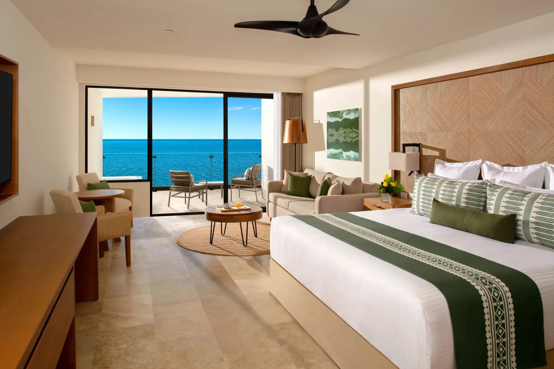 Spacious Junior Suite with plush king bed and stunning oceanfront views.