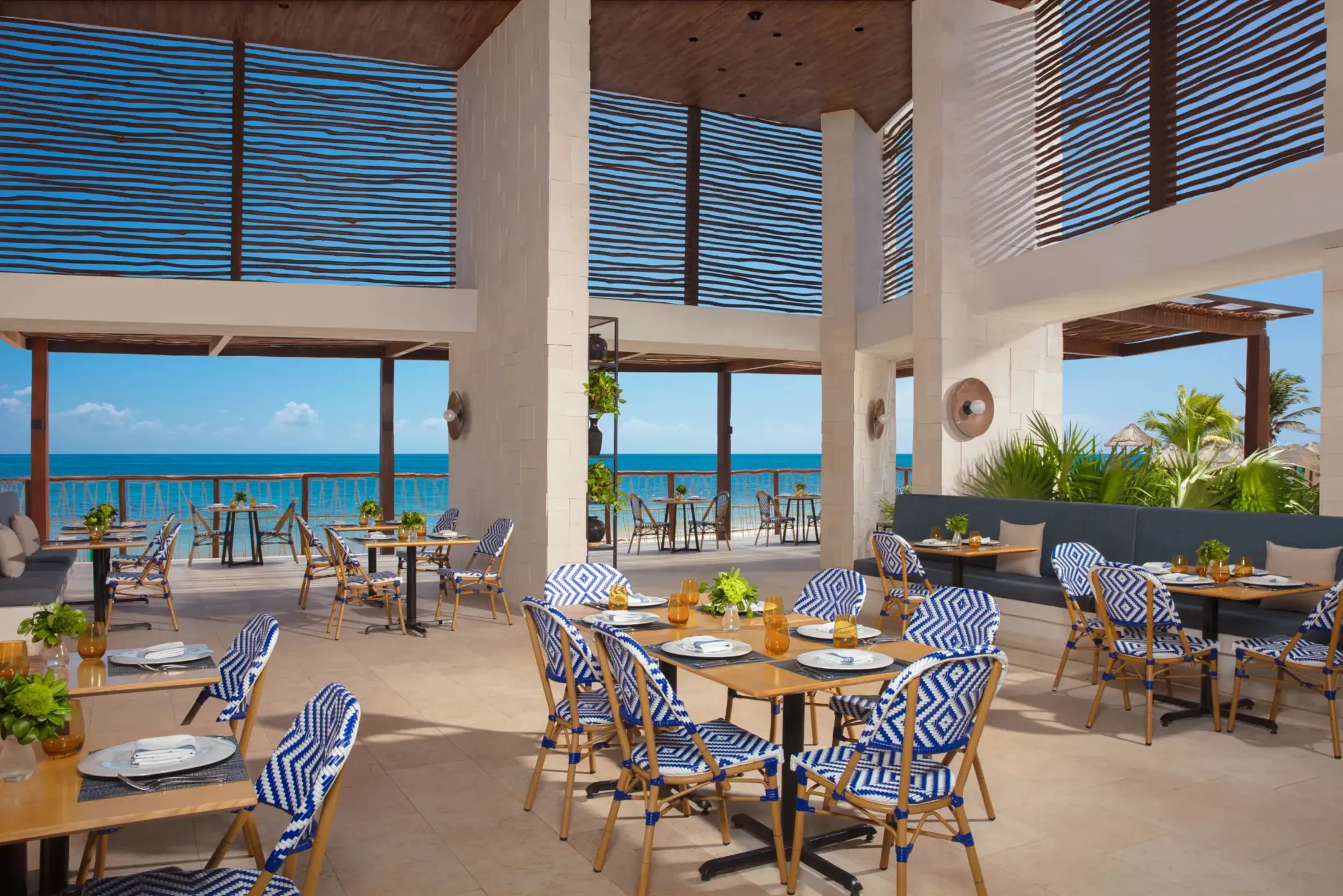 Beachside dining at Bluewater Grill with ocean breezes, fresh seafood, and a relaxed coastal vibe at Dreams Sapphire Resort.