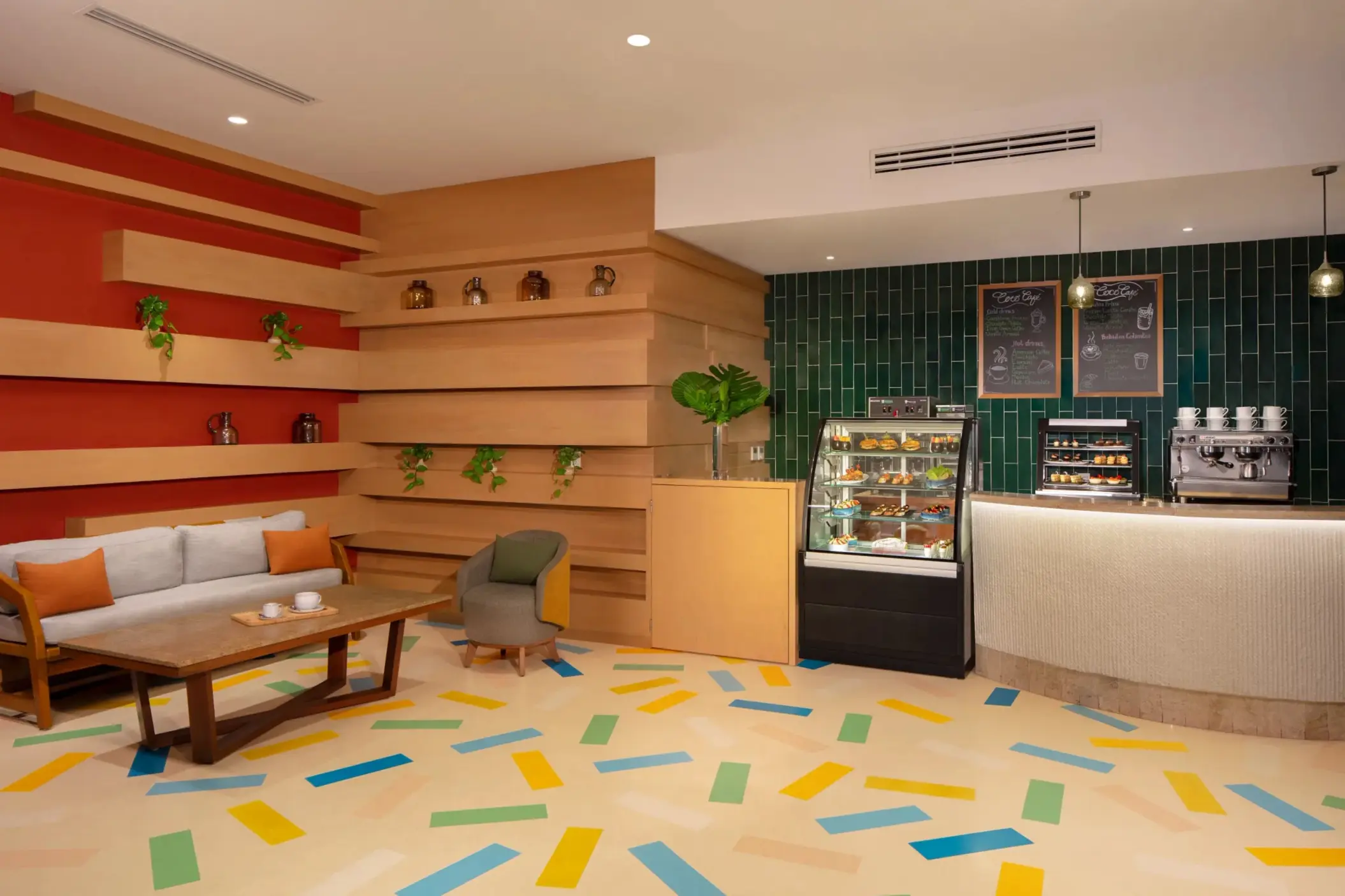 Cozy and modern Coco Café, serving premium coffee, pastries, and grab-and-go treats in a laid-back lounge setting.