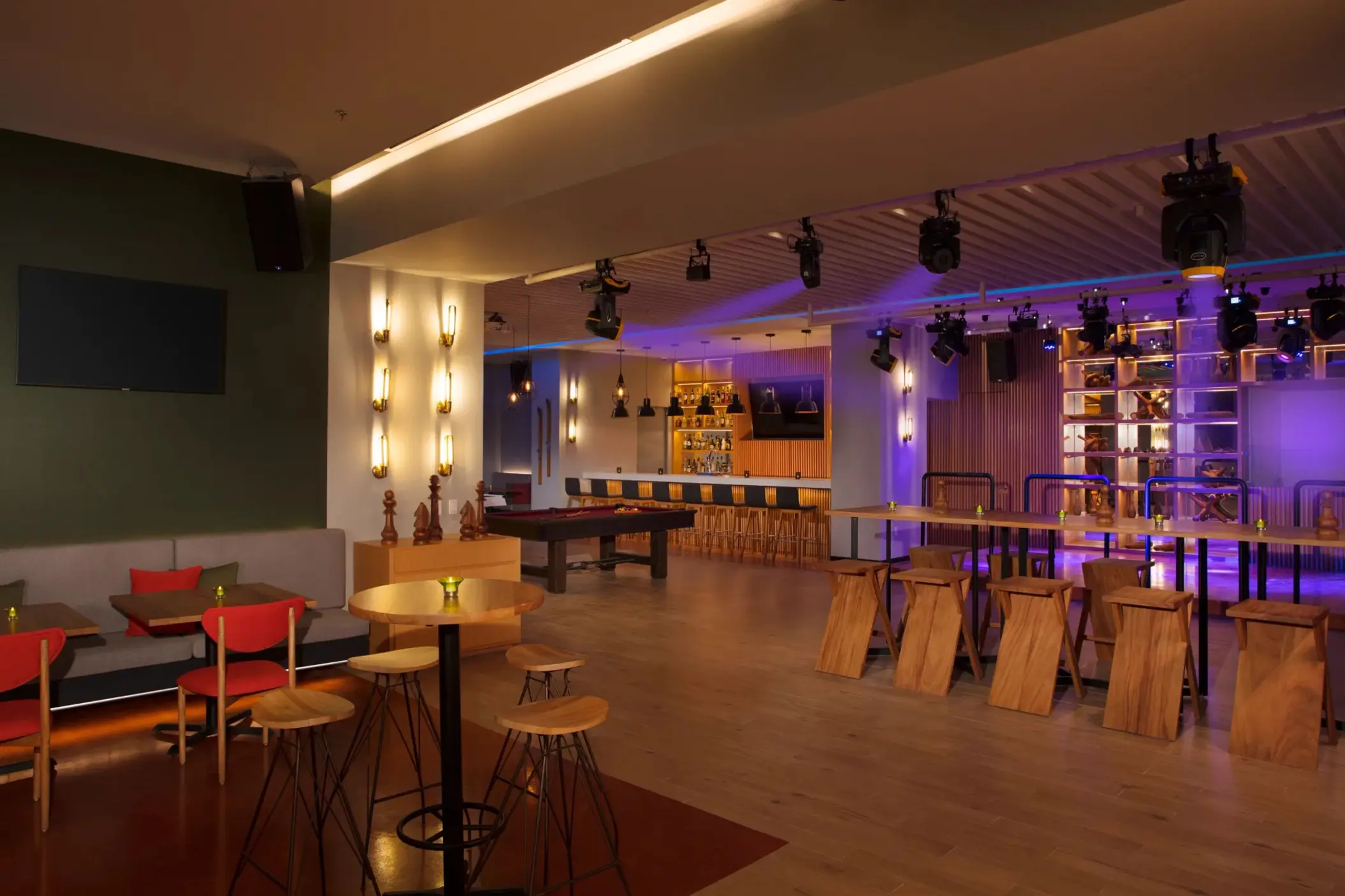 Desires Bar and Lounge with dance floor, modern lighting, high tables, and billiards area.