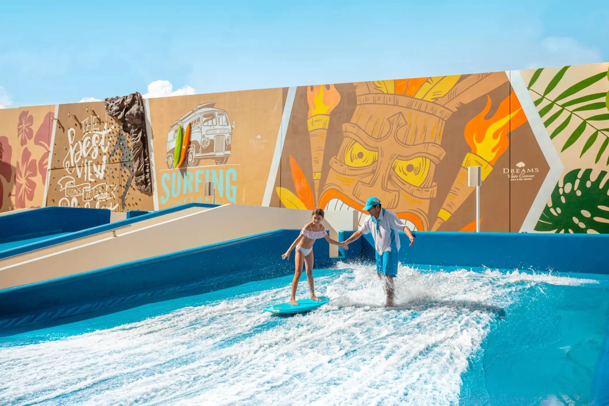 Colorful splash park with water slides, tipping buckets, and fun surfboard decor for kids to enjoy.