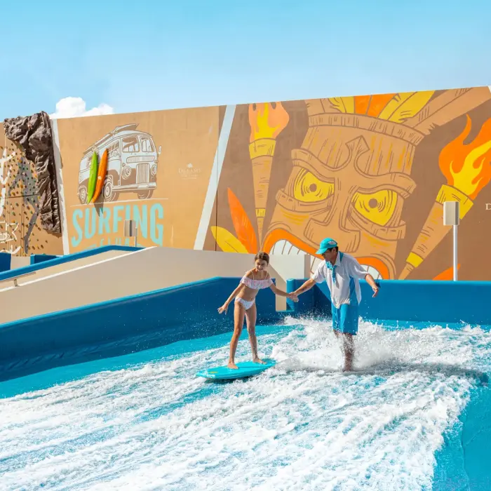 Colorful splash park with water slides, tipping buckets, and fun surfboard decor for kids to enjoy.