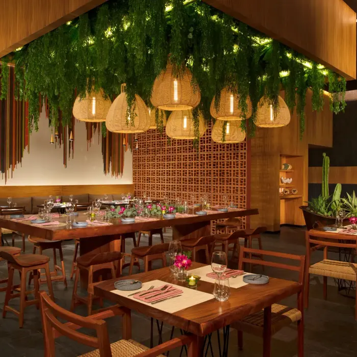 Mi Lucrecia restaurant with Mexican decor, warm lighting, and traditional design touches.