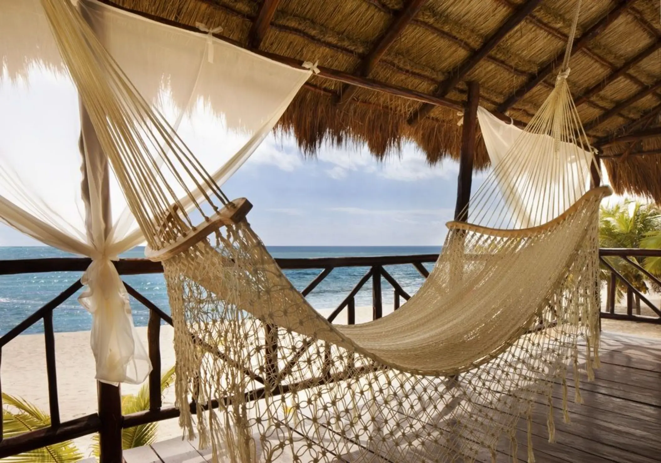 hammock in the balcony with views of the sea at El Dorado Casitas Royale