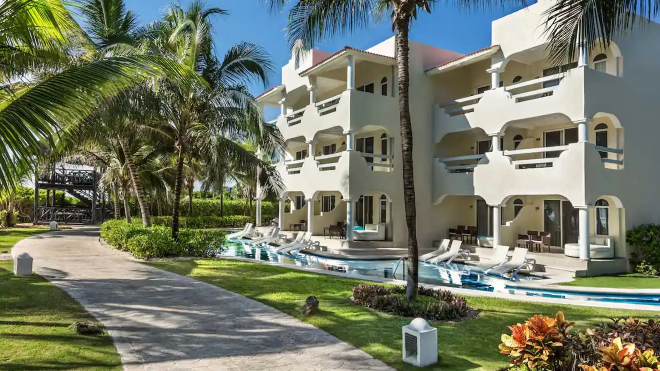 exterior of the swim out suites and the landscaped gardens at El Dorado Royale