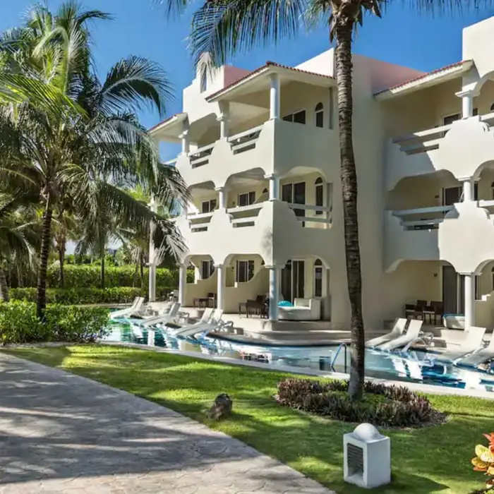 exterior of the swim out suites and the landscaped gardens at El Dorado Royale