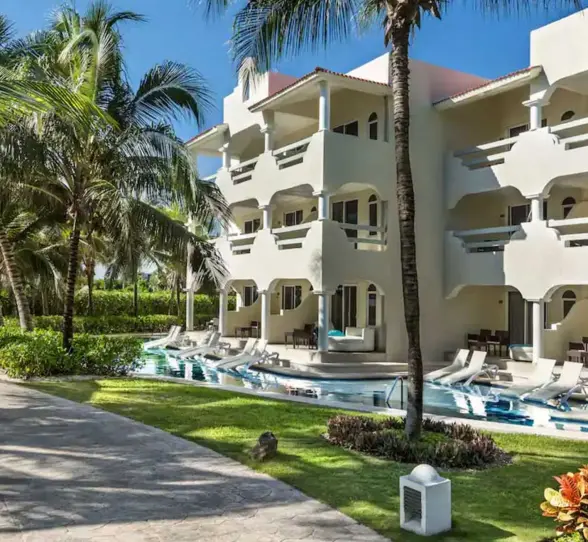 exterior of the swim out suites and the landscaped gardens at El Dorado Royale