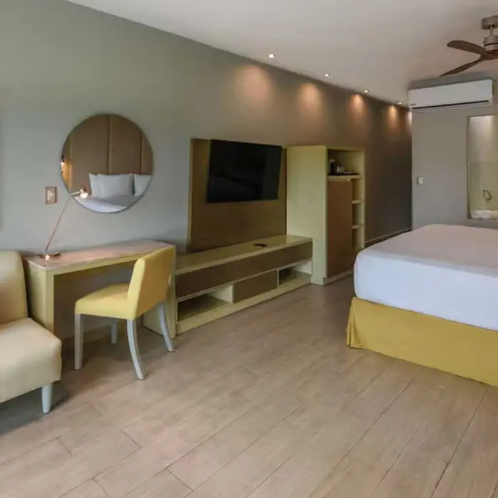 suite with office table and king bed and living aera at El Dorado Royale