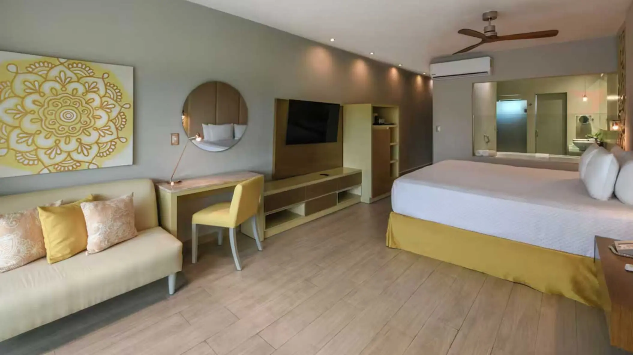 suite with office table and king bed and living aera at El Dorado Royale