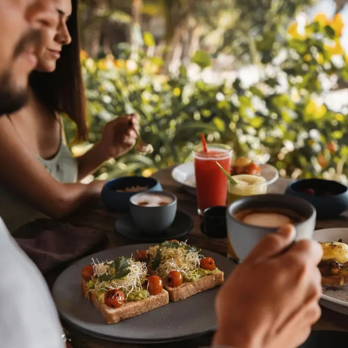couple having breakfast at Encantada Tulum