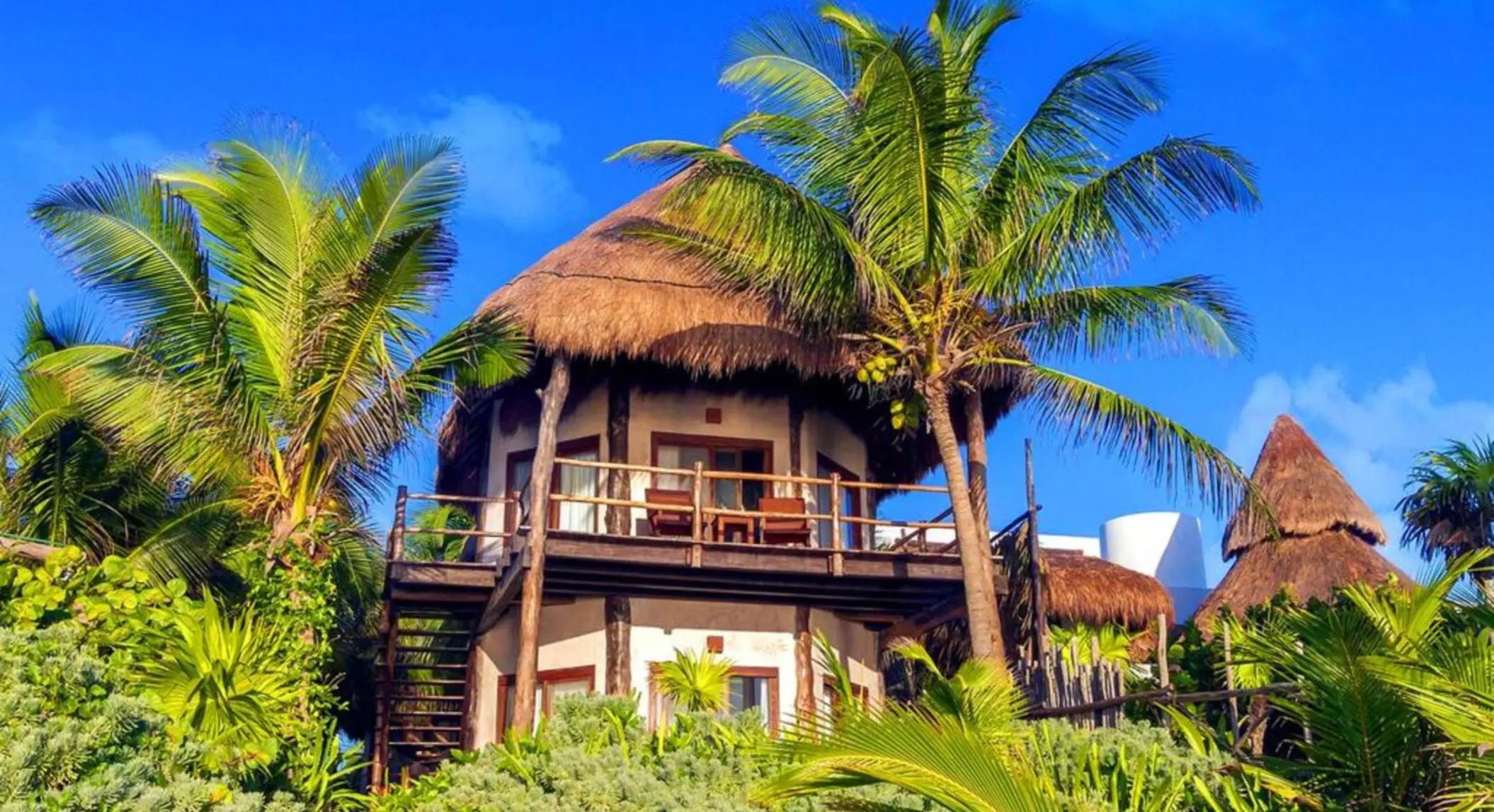 Encantada Tulum resort exteriors with palms and greenery