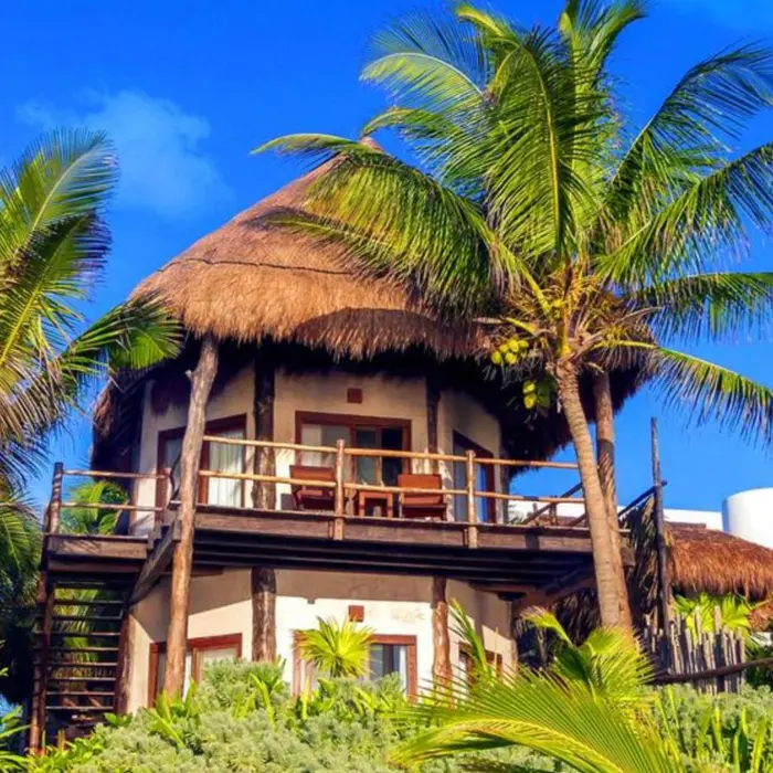 Encantada Tulum resort exteriors with palms and greenery