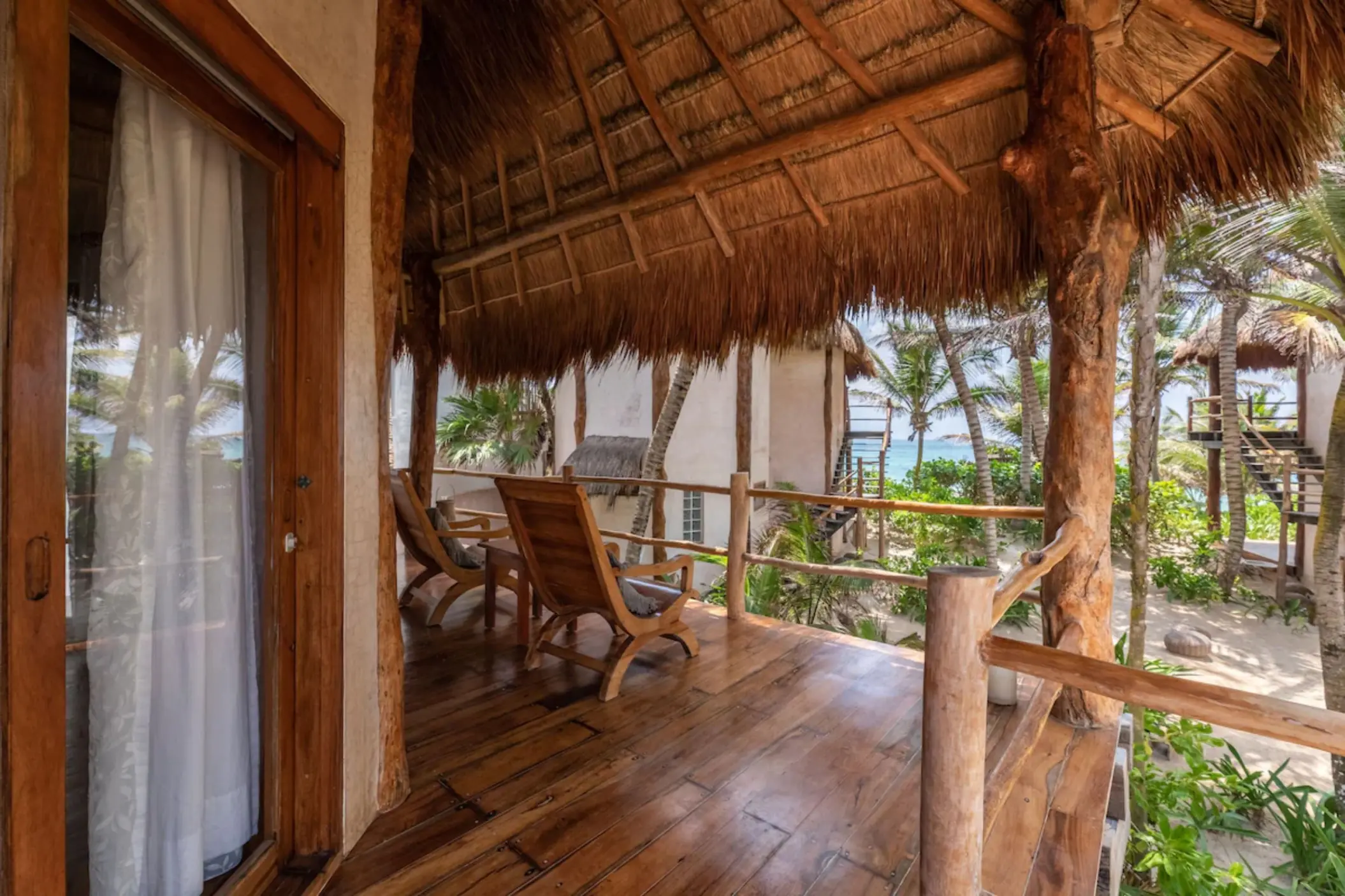 patio of suite with partial ocean view at Encantada Tulum