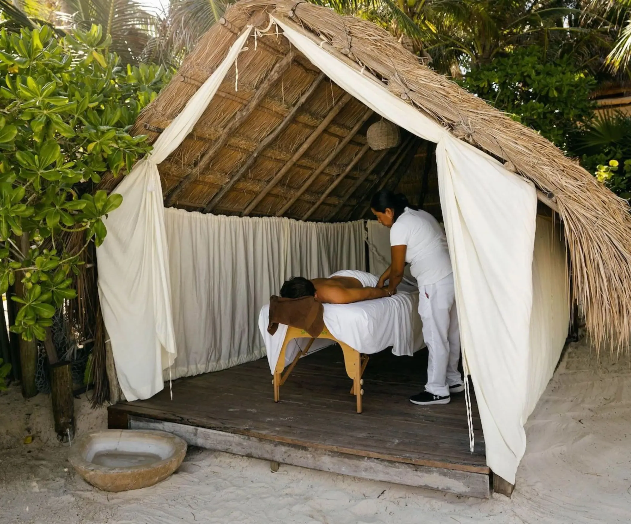 soothing massage on the beach at Encantada Tulum