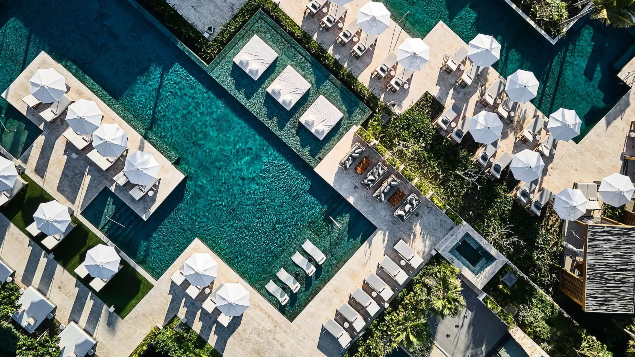 top view of the pools and loungers at Etereo Riviera Maya