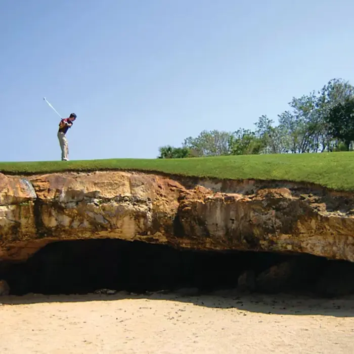 man playing golf at the course at Fairmont Mayakoba