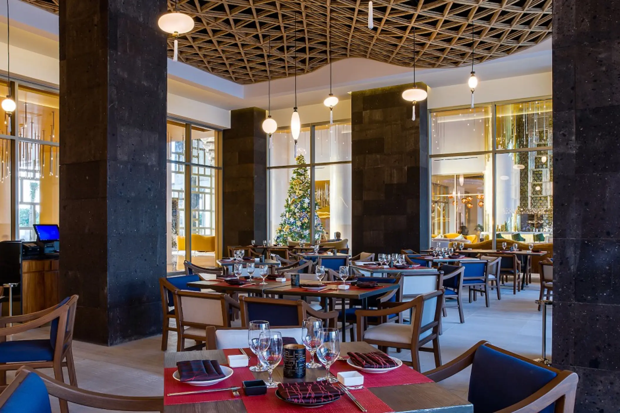 Modern dining space with warm lighting, decorative wall panels, and contemporary Japanese design.