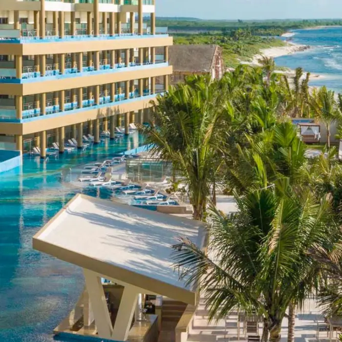 exterior of Generations Riviera Maya Resort wit its pools