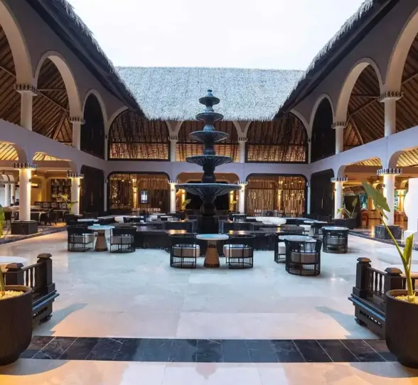 central fountain with seating around it at grand palladium colonial