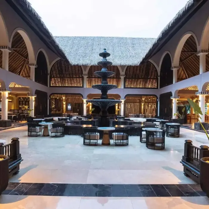 central fountain with seating around it at grand palladium colonial