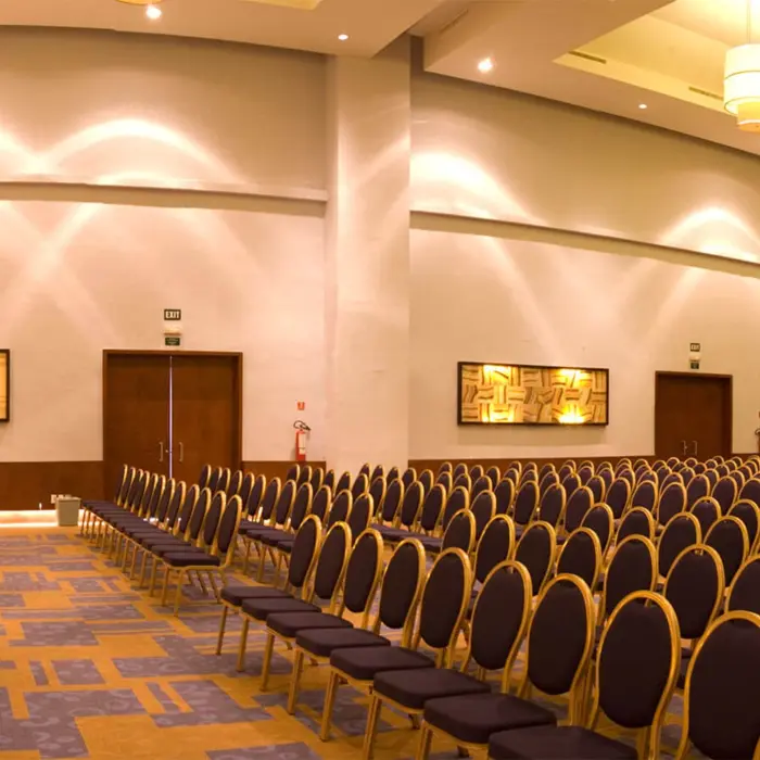 Large, organized meeting and conference room at Grand Riviera Princess with rows of chairs facing a presentation table.