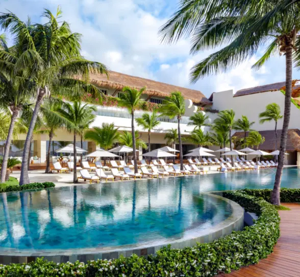pool with poolside loungers at grand velas riviera maya resort